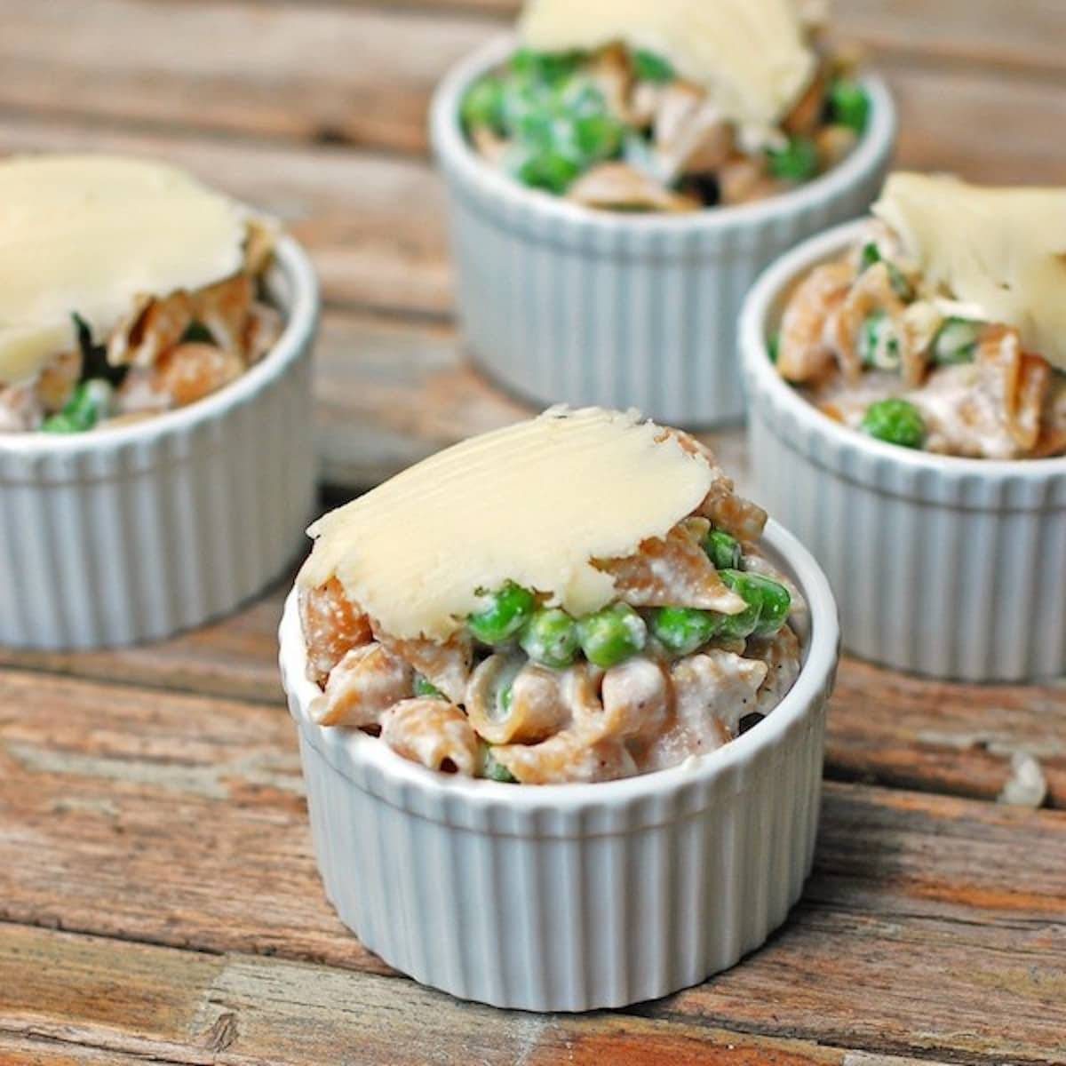 Pasta baked in ramekins and topped with cheese.