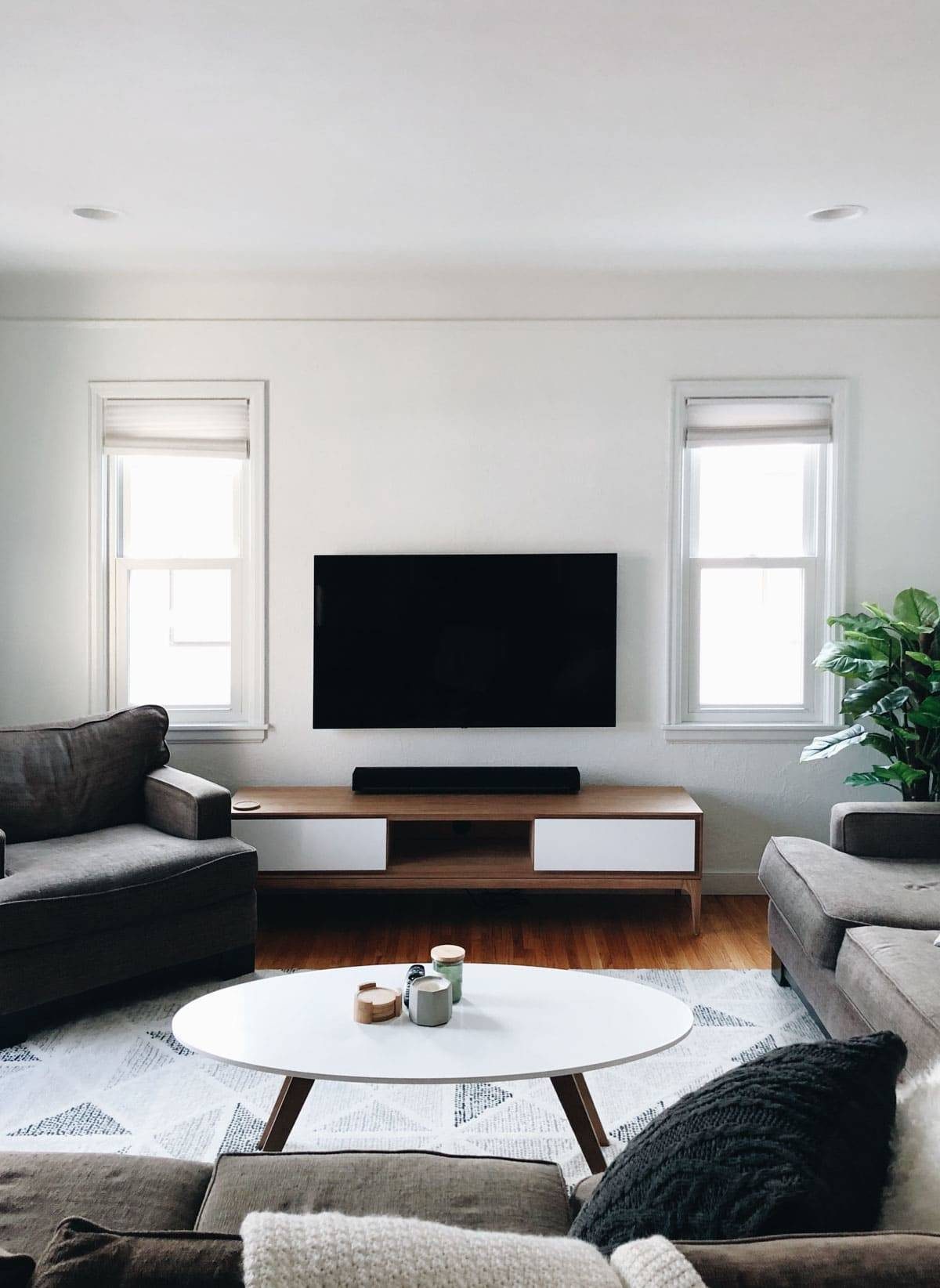 Living room with television on wall.