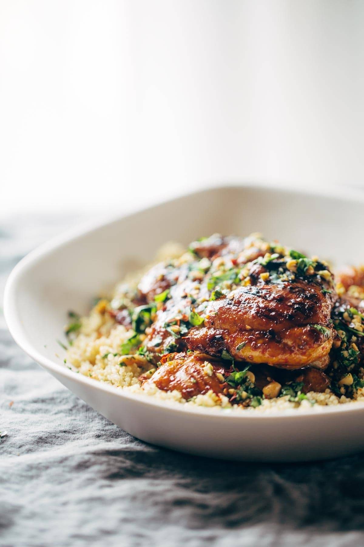 chicken and quinoa with cilantro in a bowl on a napkin
