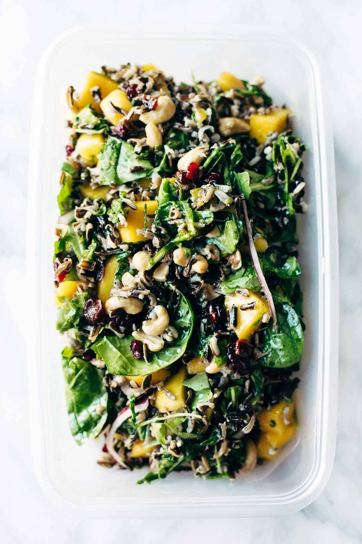 Easy Thanksgiving Salad - arugula, wild rice, cashews, dried cranberries, red onions, and a lemon dressing that shakes up easily in a jar. | pinchofyum.com Easy Thanksgiving Salad - arugula, wild rice, cashews, dried cranberries, red onions, and a lemon dressing that shakes up easily in a jar. | pinchofyum.com