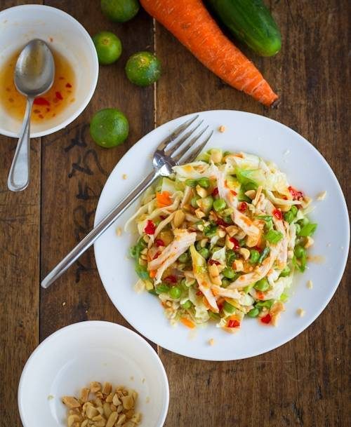 Asian chicken salad on a plate with a fork.