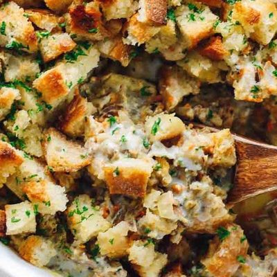 Chicken Wild Rice Casserole in a dish with a spoon.